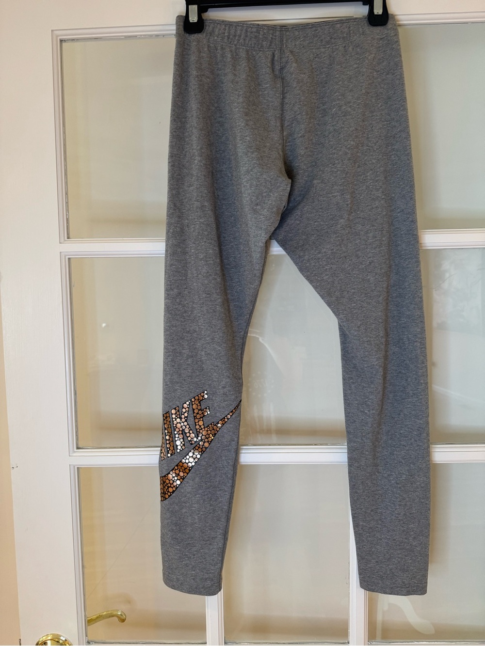 Nike Gray Wimen’s Leggings with Metallic Logo on Back of Leg